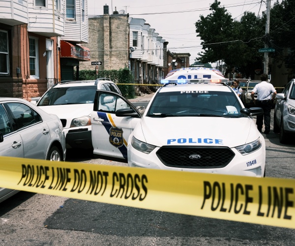 Police tape blocks a street