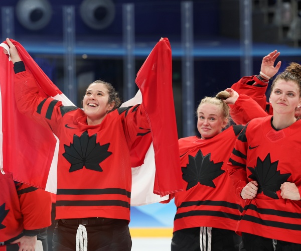 Team Canada celebrates on the ice 