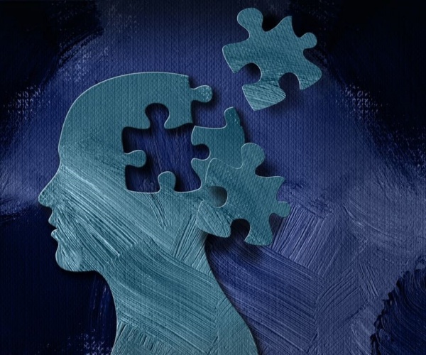 illustration of a head with puzzle pieces missing, signifying dementia