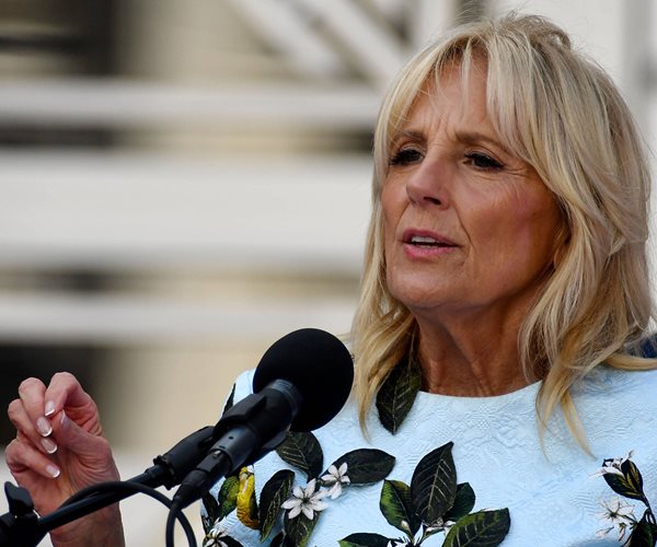 jill biden speaks into a microphone