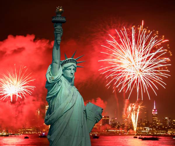 fireworks behind the statue of liberty