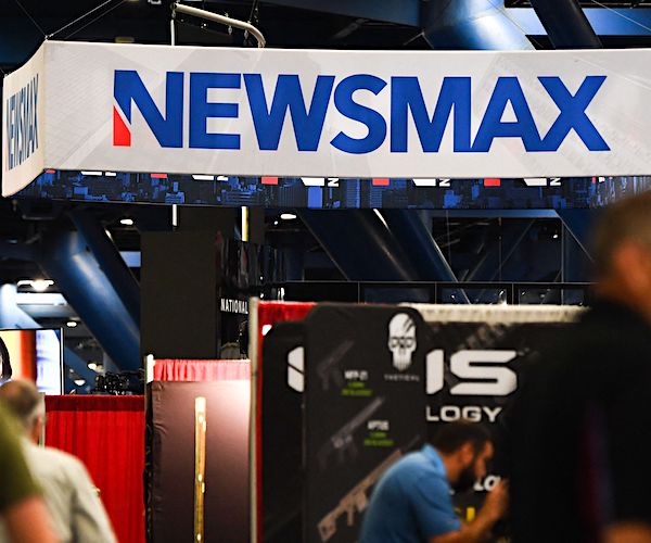 a newsmax sign at an event