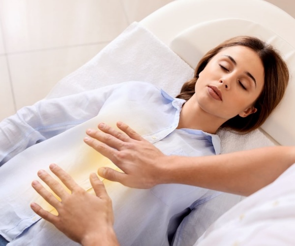 woman on table during a reiki session