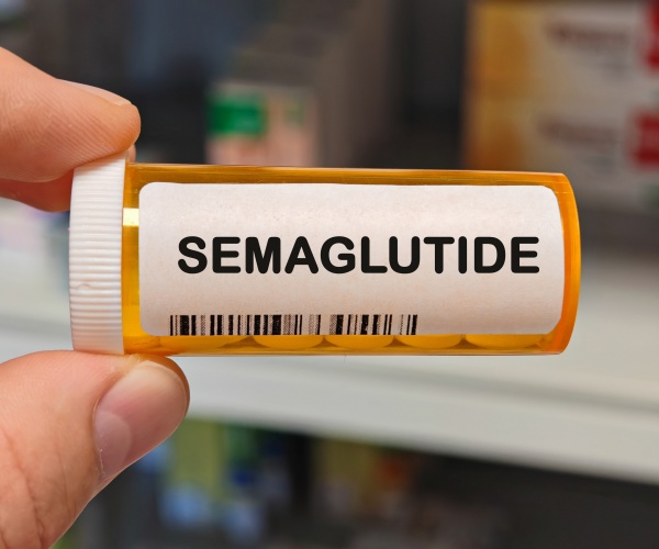 prescription vial labeled 'semaglutide' with pills inside