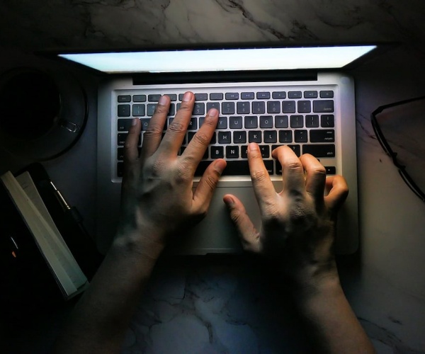 person staying up late working on laptop