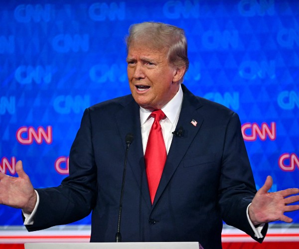 Donald Trump gestures while speaking