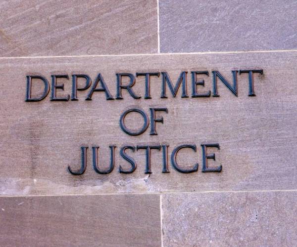 a sign on the department of justice building