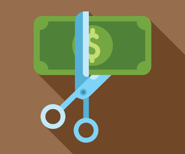 an illustration of scissors cutting a dollar bill