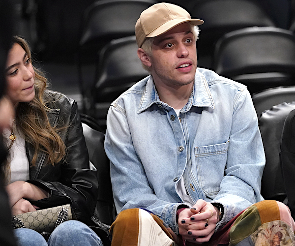 pete davidson sits and takes in an nba game