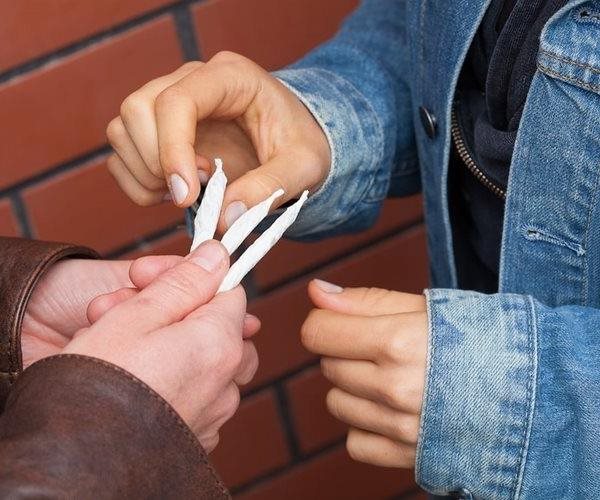 kids deal drugs in a back alley in an illustration