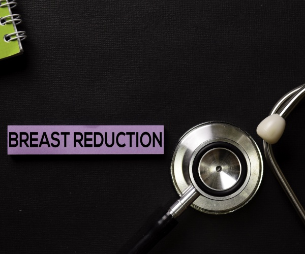 'Breast Reduction' in letters, stethoscope