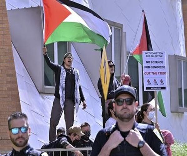 protesters wave flag at mit