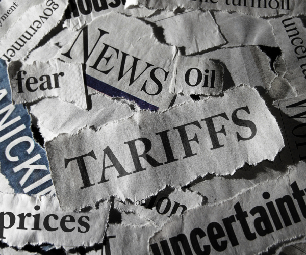 parts of headlines stacked up with tariffs as the main word