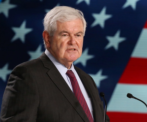 newt gingrich speaks into mic