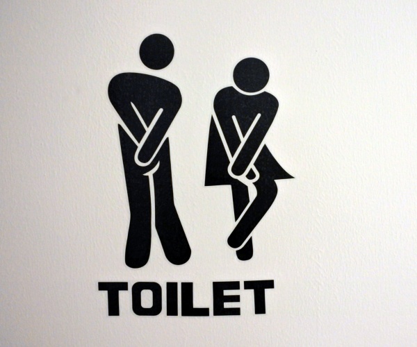 illustration of a man and woman having to urinate, trying to hold in