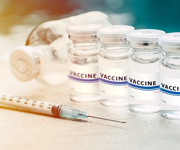 syringe and vaccine vials