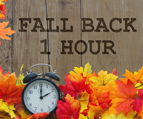 'Fall Back 1 Hour' with fall leaves