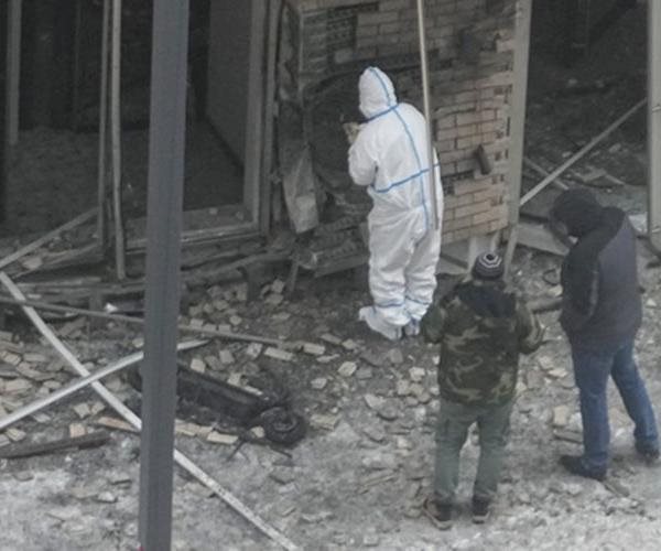 crews clean up the debris after a terrorist strike on a russian nuclear general