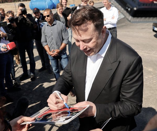 elon musk signing autographs