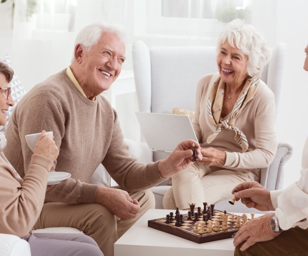 older people playing chess, socializing