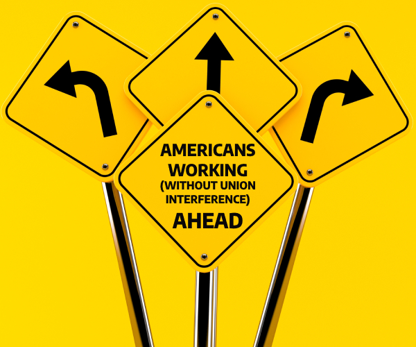 a road sign reading americans working without union interference