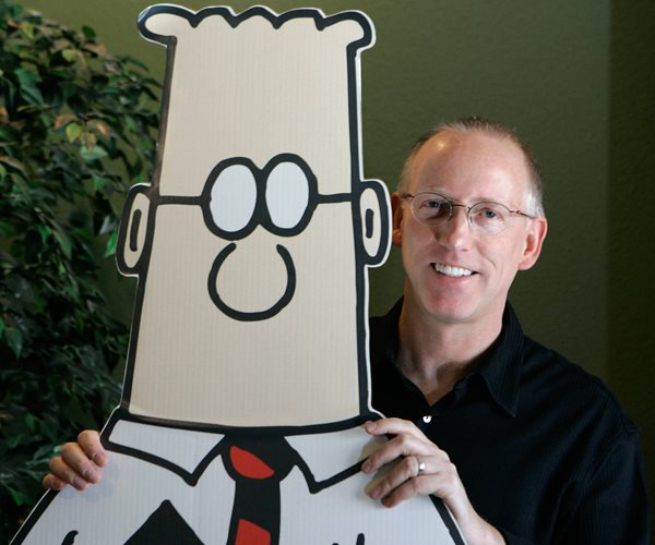 scott adams with a dilbert cardboard cutout 