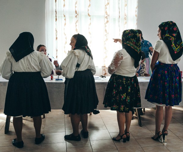 women voting in an overseas political election