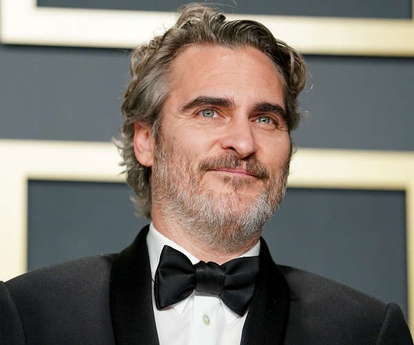 joaquin phoenix stands in press room 