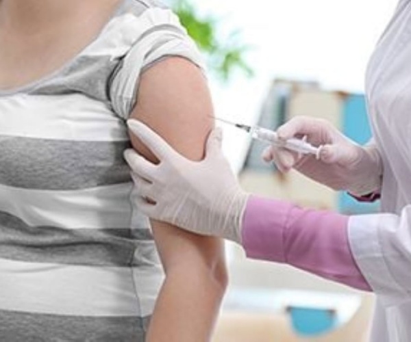 woman getting a vaccine