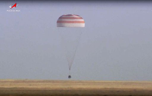 A Soyuz Capsule with 2 Russians and 1 American from the International Space Station Returns to Earth