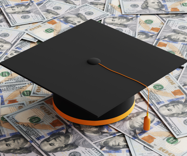 black graduate mortar board on heap of randomly scattered banknotes