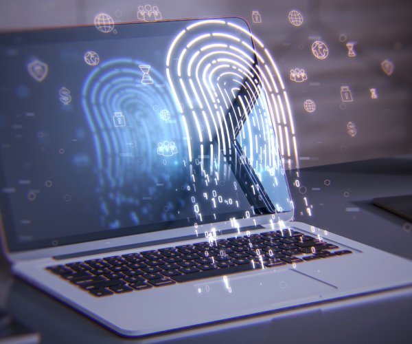 laptop on a deskt withglowing digital fingerprint hologram
