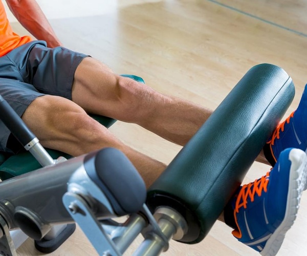 man in gym on exercise equipment