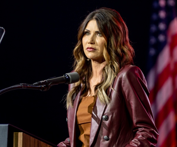 kristi noem speaks into a microphone