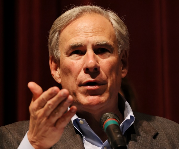 greg abbott gestures while speaking