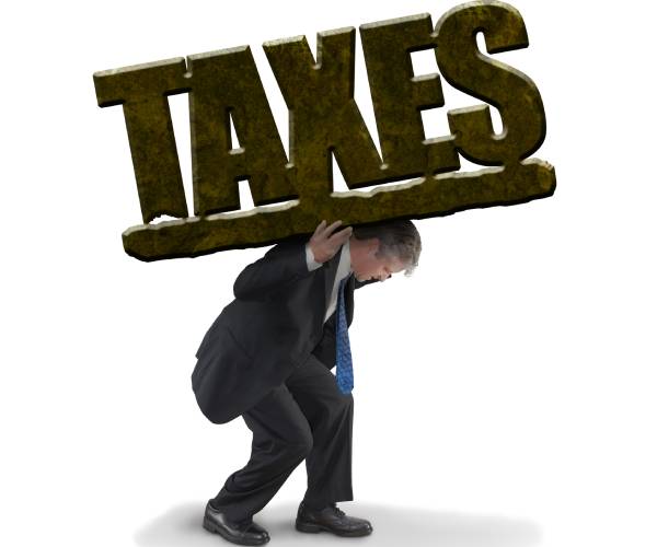 a man in a suit carrying a heavy word taxes on his back