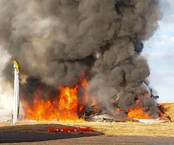 Jeju Air Flight 7C2216 burns after skidding off the runway at Muan International Airport on Sunday in Muan-gun