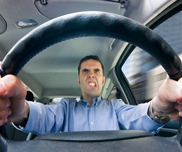 angry man driving car 