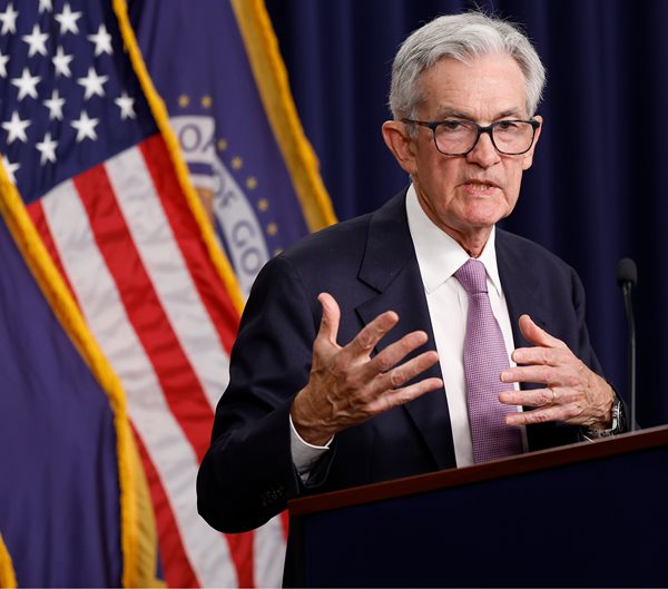 Fed Cuts Key Rate by Quarter-Point, Calls Inflation 'Elevated'