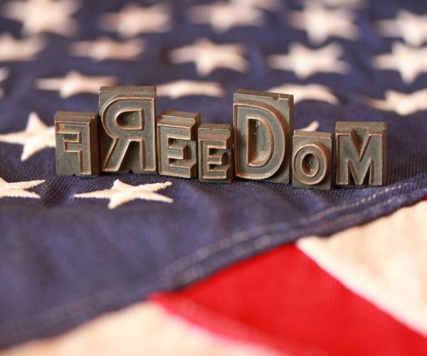 american flag and the word freedom