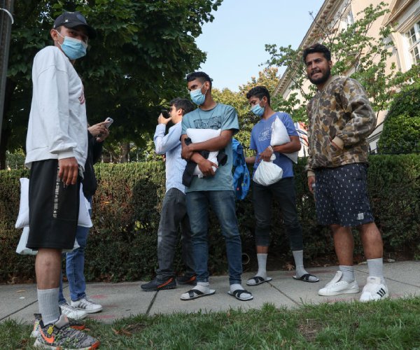 migrants gathering near the residence of vice president kamala harris after being dropped off