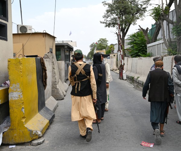 taliban fighters patrolling a road in kabul afghanistan 