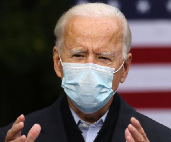 joe biden delivers remarks wearing a mask 