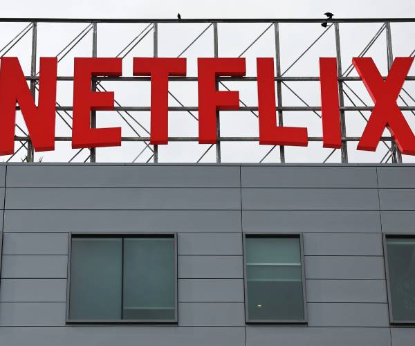 netflix sign on top of a building