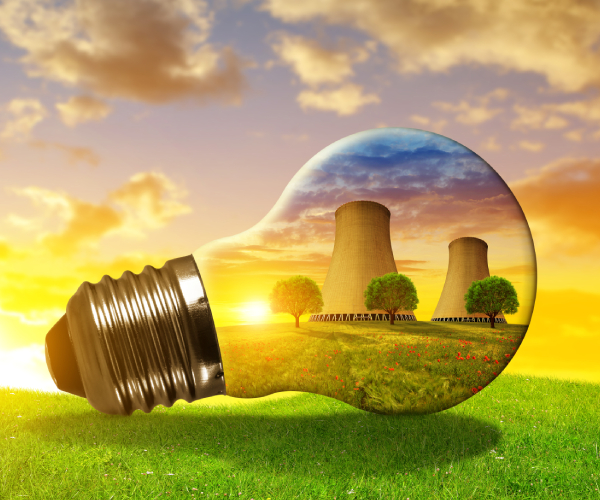 a nuclear power plant seen through a clear light bulb