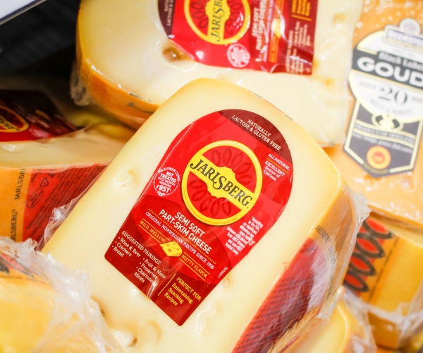 Jarlsberg cheese in refrigerated section