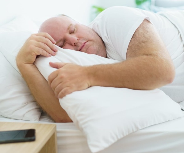 man sleeping late in morning 