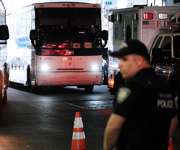 A bus carrying migrants who crossed the border from Mexico into Texas arrives into the Port Authority bus station
