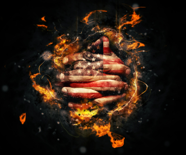 hands painted like american flag folded in prayer with fire swirling around them