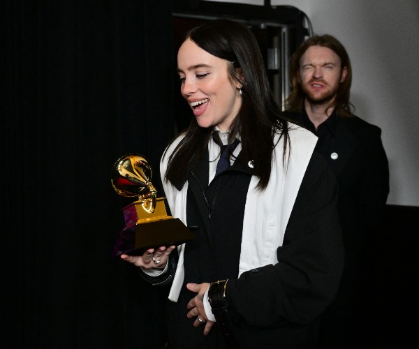 singer song writer receives award for song of the year in the city of angels of the golden state of the united states 